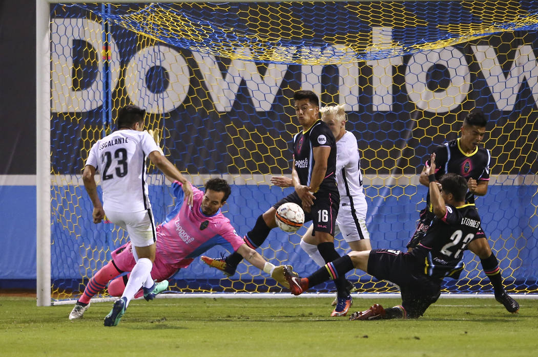 San Antonio FC midfielder Jose Escalante (23) scores a goal past Las Vegas Lights FC goalkeeper Ricardo Ferriño (1) during the first half of a United Soccer League game at Cashman Field in Las Ve ...
