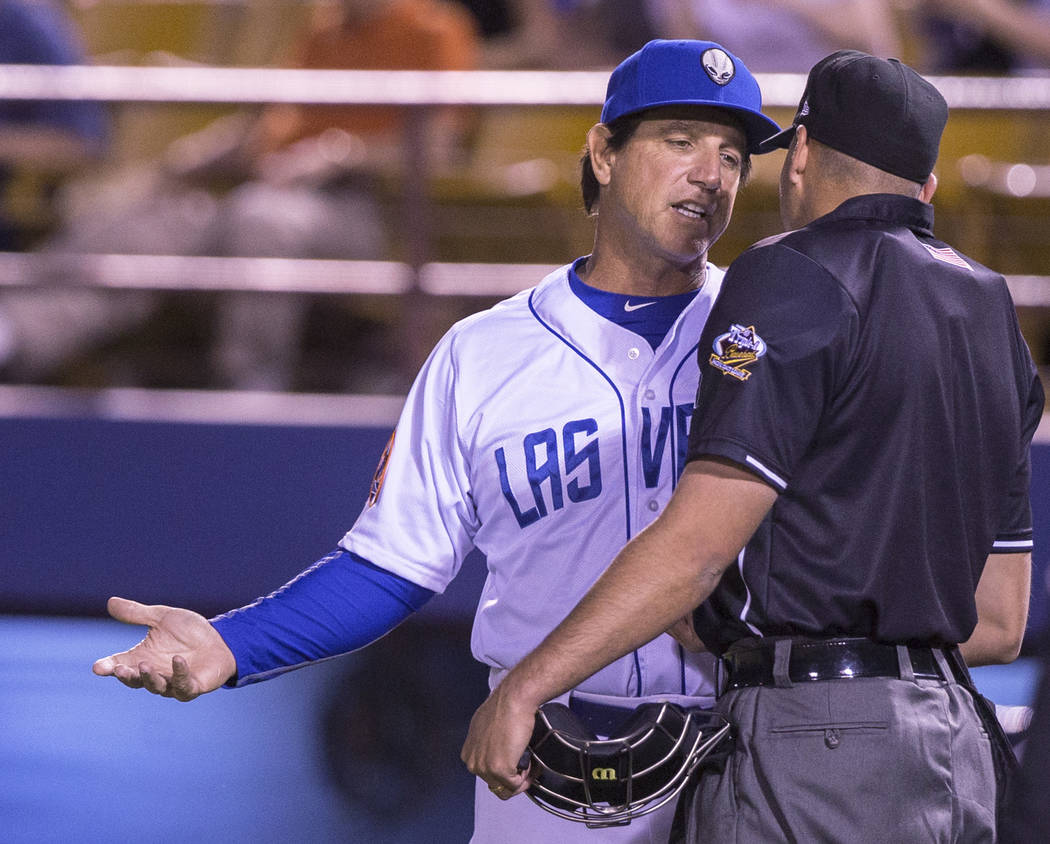 51s manager Tony DeFrancesco, left, argues a call during Las Vegas' home matchup with the El Paso Chihuahuas on Monday, April 9, 2018, at Cashman Field, in Las Vegas. Benjamin Hager Las Vegas Revi ...
