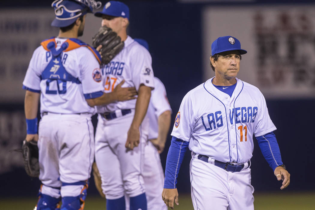 51s manager Tony DeFrancesco, right, walks back to the dugout after making a pitching change during Las Vegas' home matchup with the El Paso Chihuahuas on Monday, April 9, 2018, at Cashman Field, ...