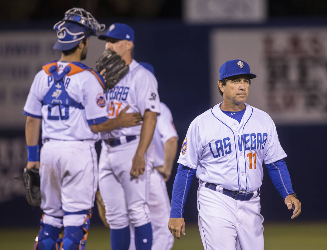 51s manager Tony DeFrancesco, right, walks back to the dugout after making a pitching change during Las Vegas' home matchup with the El Paso Chihuahuas on Monday, April 9, 2018, at Cashman Field, ...