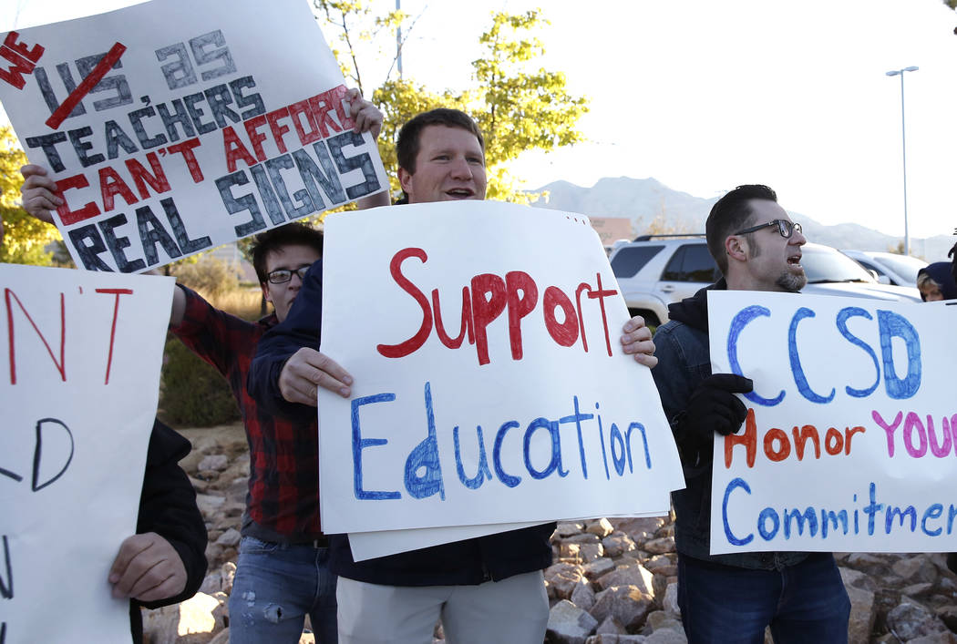 Teachers, including Matt Nighswonger, center, protest outside Shadow Ridge High School on Tuesday, April 17, 2018, in Las Vegas. Bizuayehu Tesfaye/Las Vegas Review-Journal @bizutesfaye