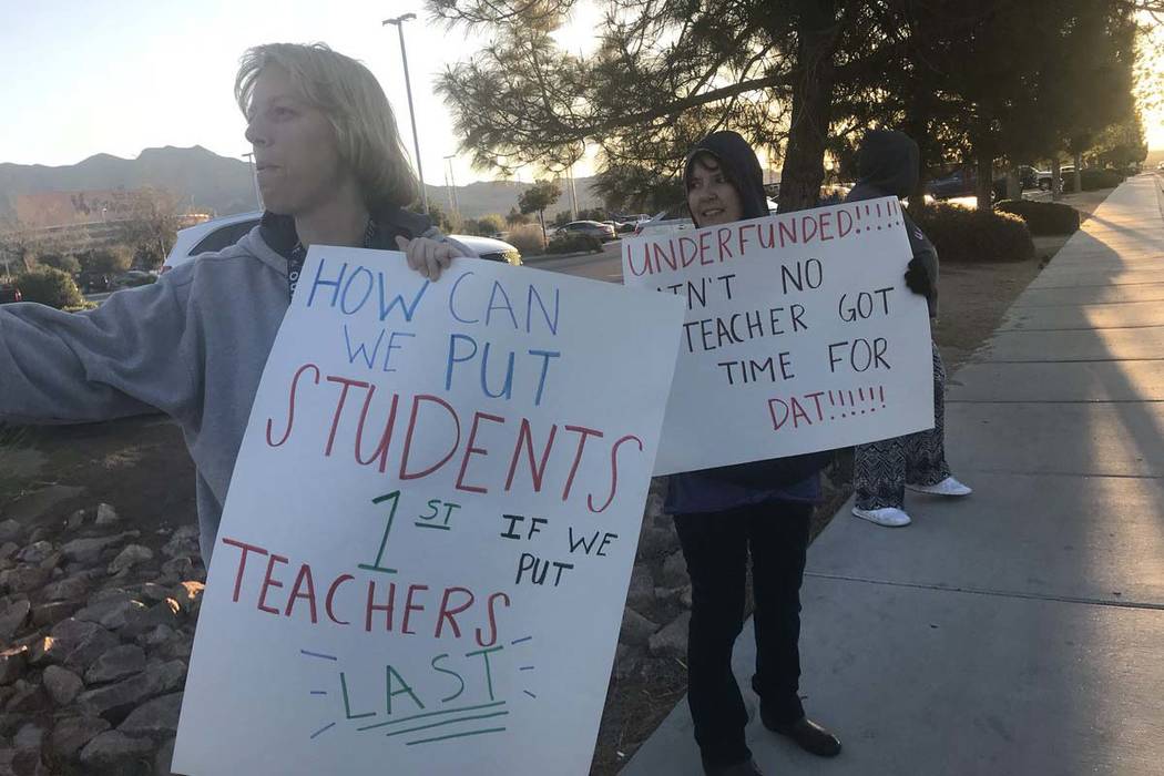 Shadow Ridge High School teachers protest against pay freezes at the school on Tuesday morning, April 17, 2018. (Amelia Pak-Harvey/Las Vegas Review-Journal)
