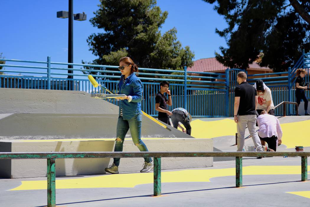 Volunteer artists help paint the skatepark at Winchester Cultural Center Tuesday, April 17, 2018. Los Angeles-based artist Andrew Schoultz joined them in advance of his solo installation at the Ma ...