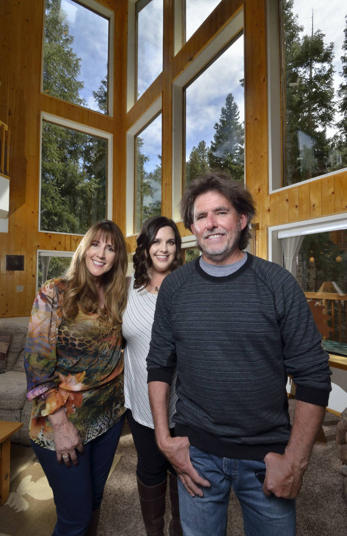 Angie, left, and Garry Tomashowski, right, are shown with their daughter, Katie Corr, at their home at 323 Mont Blanc Way on Mount Charleston. (Bill Hughes Real Estate Millions)