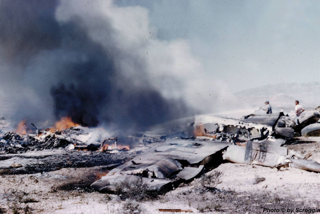 The wreckage of a United Airlines DC-7 smolders in the desert southwest of Las Vegas after a midair collision and crash that killed 49 people on April 21, 1958. Courtesy of Doug Scroggins