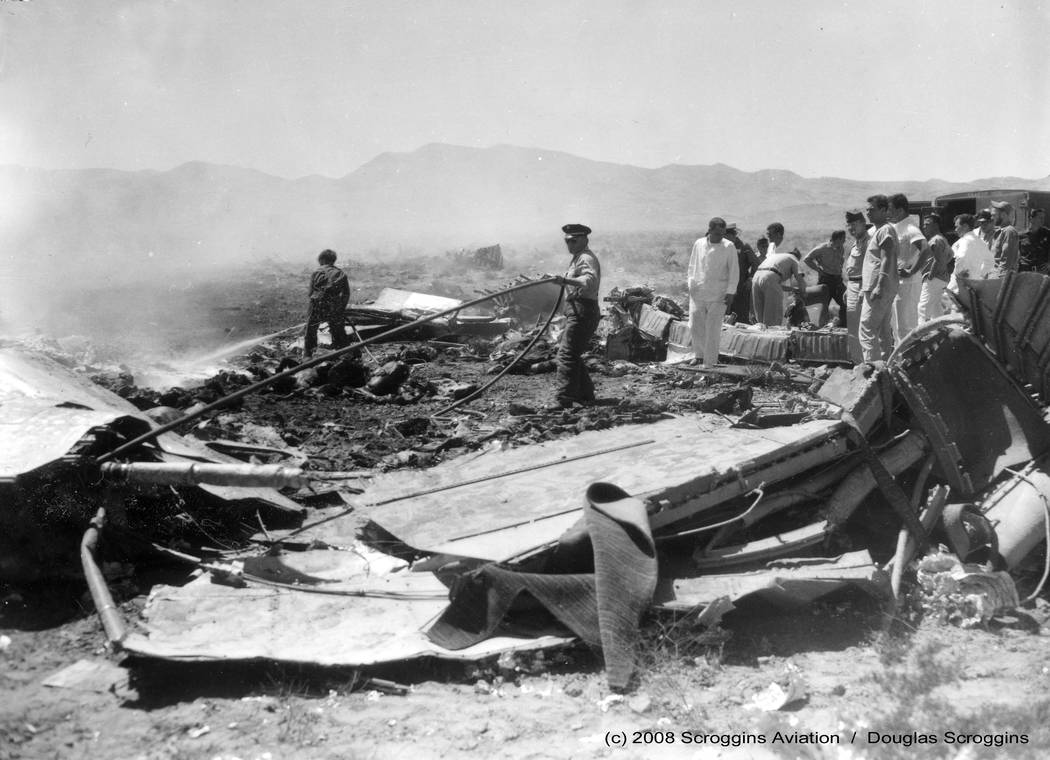 Rescue workers comb the wreckage of United Air Lines flight 736 on April 21, 1958. The crash killed 49 people after it collided with an Air Force jet out of Nellis Air Force Base. Las Vegas Review ...