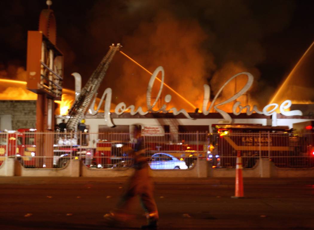 City of Las Vegas fire fighters battle the fire at the historic Moulin Rouge early Thursday morning, May 29, 2003. The three-alarm blazed gutted the city's first racially integrated casino. It ope ...