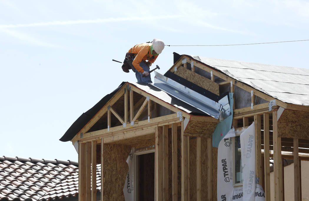 A construction worker puts a roof on a new home at the Cove at Southern Highlands and St. Rose parkways on Wednesday, April 18, 2018, in Las Vegas. Bizuayehu Tesfaye/Las Vegas Review-Journal @bizu ...