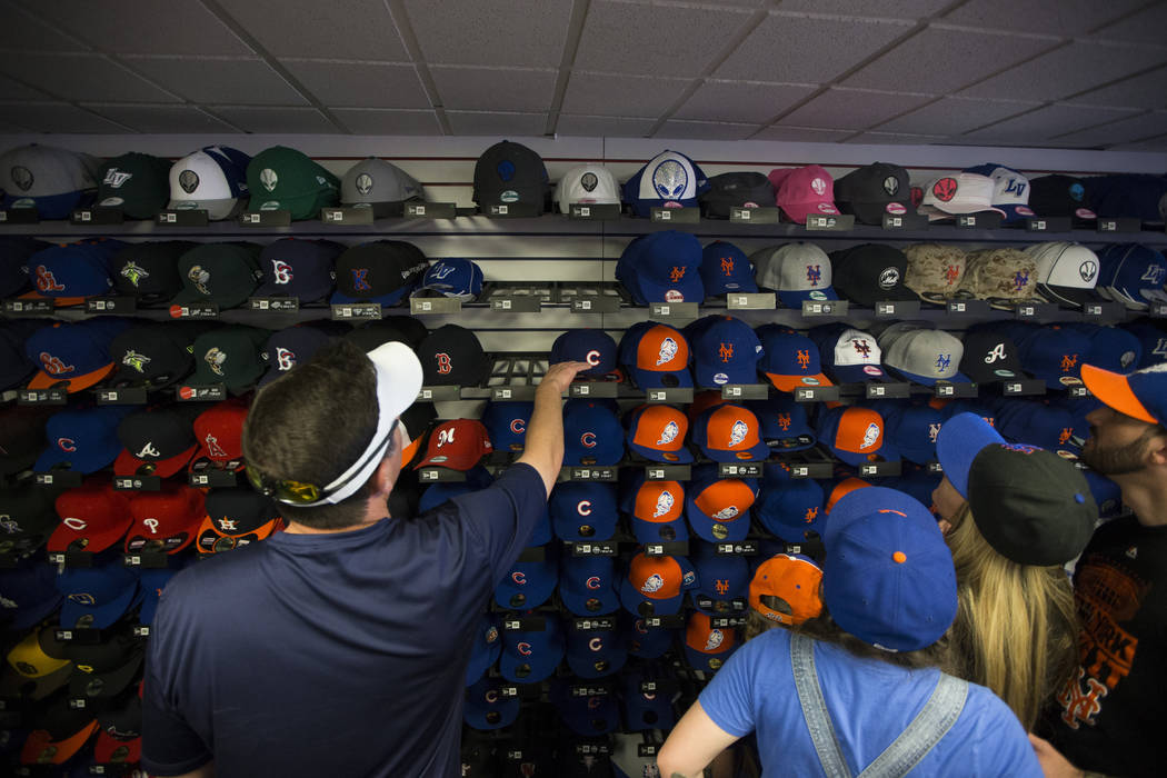 Fans browse team merchandise during the Big League Weekend baseball game between the Chicago Cubs and the New York Mets at Cashman Field on Friday, March 1, 2016, in Las Vegas. The Mets won 8-1. E ...