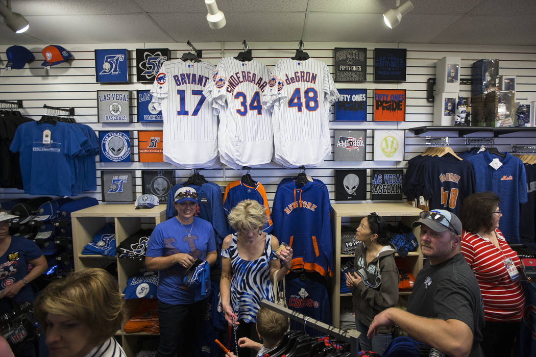 Fans browse team merchandise during the Big League Weekend baseball game between the Chicago Cubs and the New York Mets at Cashman Field on Friday, March 1, 2016, in Las Vegas. The Mets won 8-1. E ...