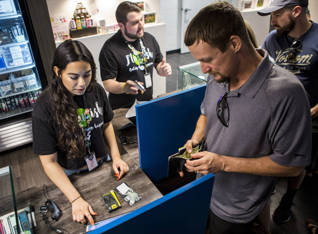 Alyssa Jusino rings up Michael Brousseau of New Mexico at Exhale Nevada on Friday, April 23, 2018. Patrick Connolly Las Vegas Review-Journal @PConnPie