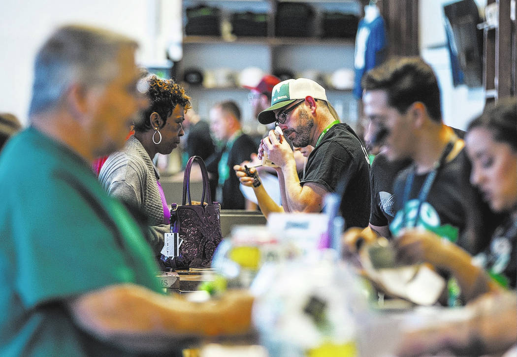 Customers check out cannabis products at Nuwu Cannabis Marketplace on Friday, April 23, 2018. Patrick Connolly Las Vegas Review-Journal @PConnPie