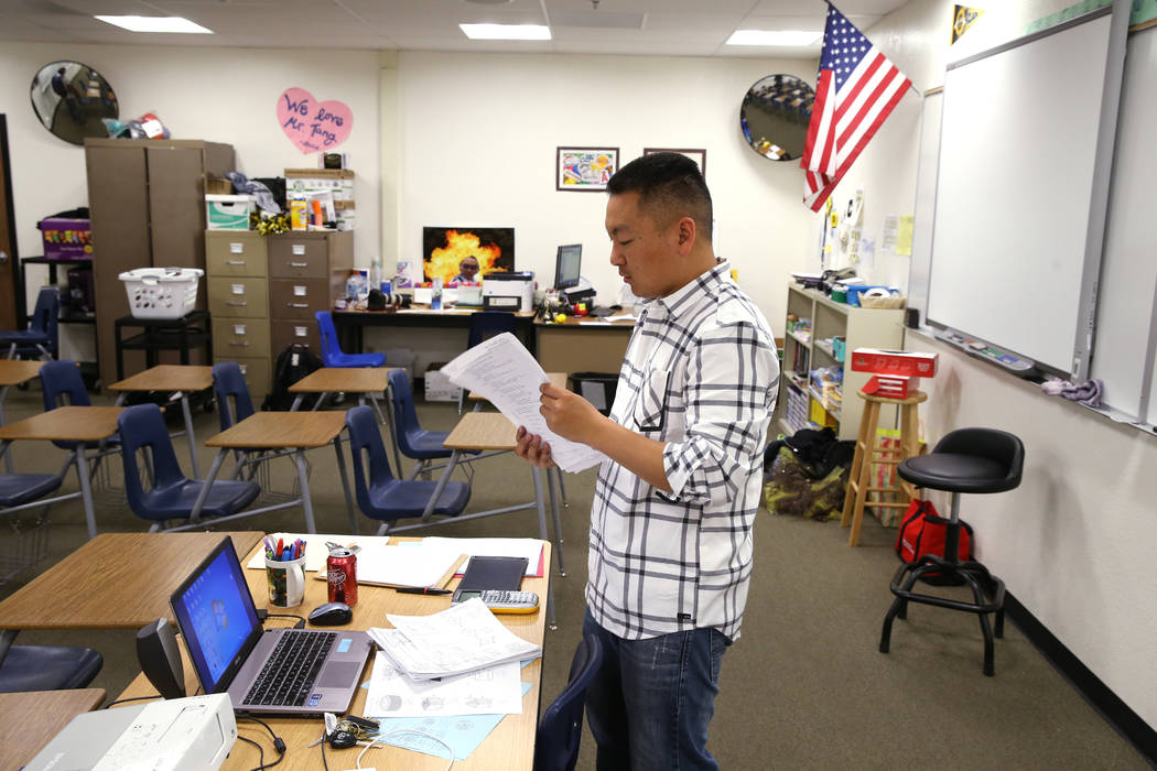 Clark High School teacher Charlie Tang cleans up after geometry class Tuesday, April 24, 2018. K.M. Cannon Las Vegas Review-Journal @KMCannonPhoto