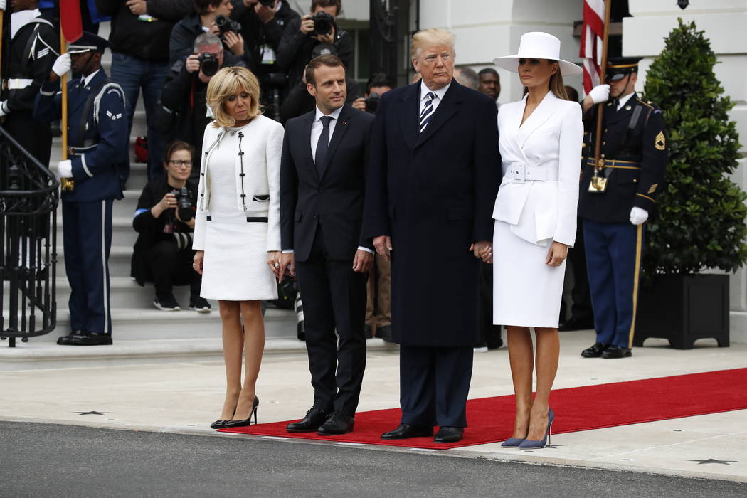 President Donald Trump, first lady Melania Trump, French President Emmanuel Macron and his wife, Brigitte Macron, stand together at the beginning of the State Arrival Ceremony at the White House i ...
