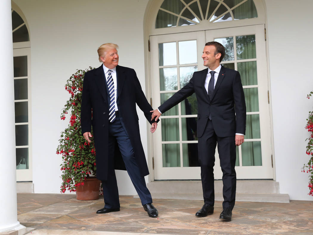President Donald Trump and French President Emmanuel Macron walk to the Oval Office of the White House in Washington, Tuesday, April 24, 2018. Trump said the partnership he forged with Macron at t ...