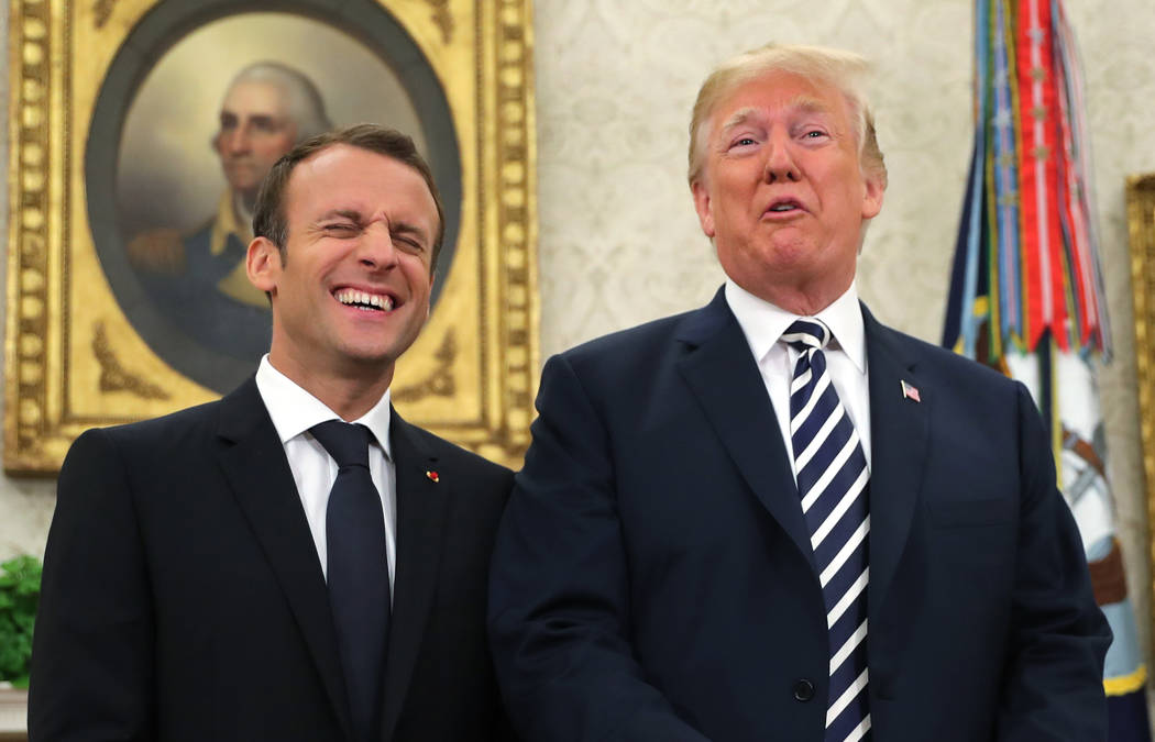President Donald Trump and French President Emmanuel Macron talk to the media at the beginning or their in Oval Office of the White House in Washington, Tuesday, April 24, 2018. (AP Photo/Pablo Ma ...