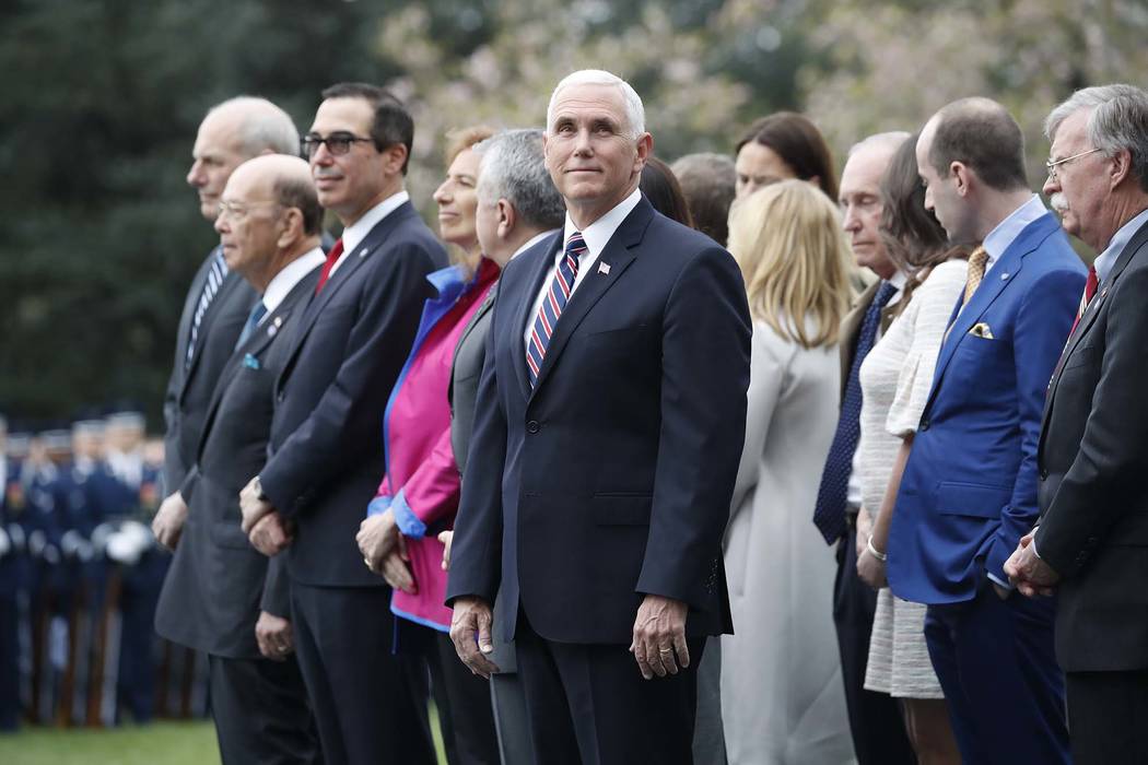Vice President Mike Pence and members of the cabinet watch during a State Arrival Ceremony on the South Lawn of the White House in Washington, Tuesday, April 24, 2018. (AP Photo/Pablo Martinez Mon ...