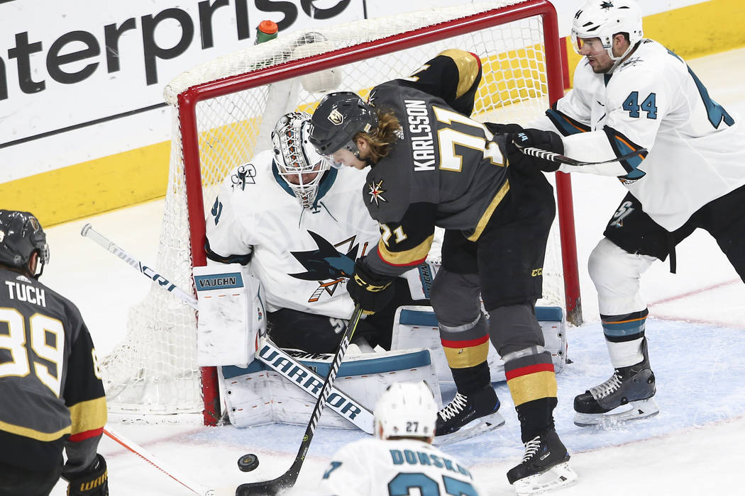 Golden Knights center William Karlsson (71) tries to score against San Jose Sharks goaltender Martin Jones (31) during the third period of an NHL hockey game at T-Mobile Arena in Las Vegas on Satu ...