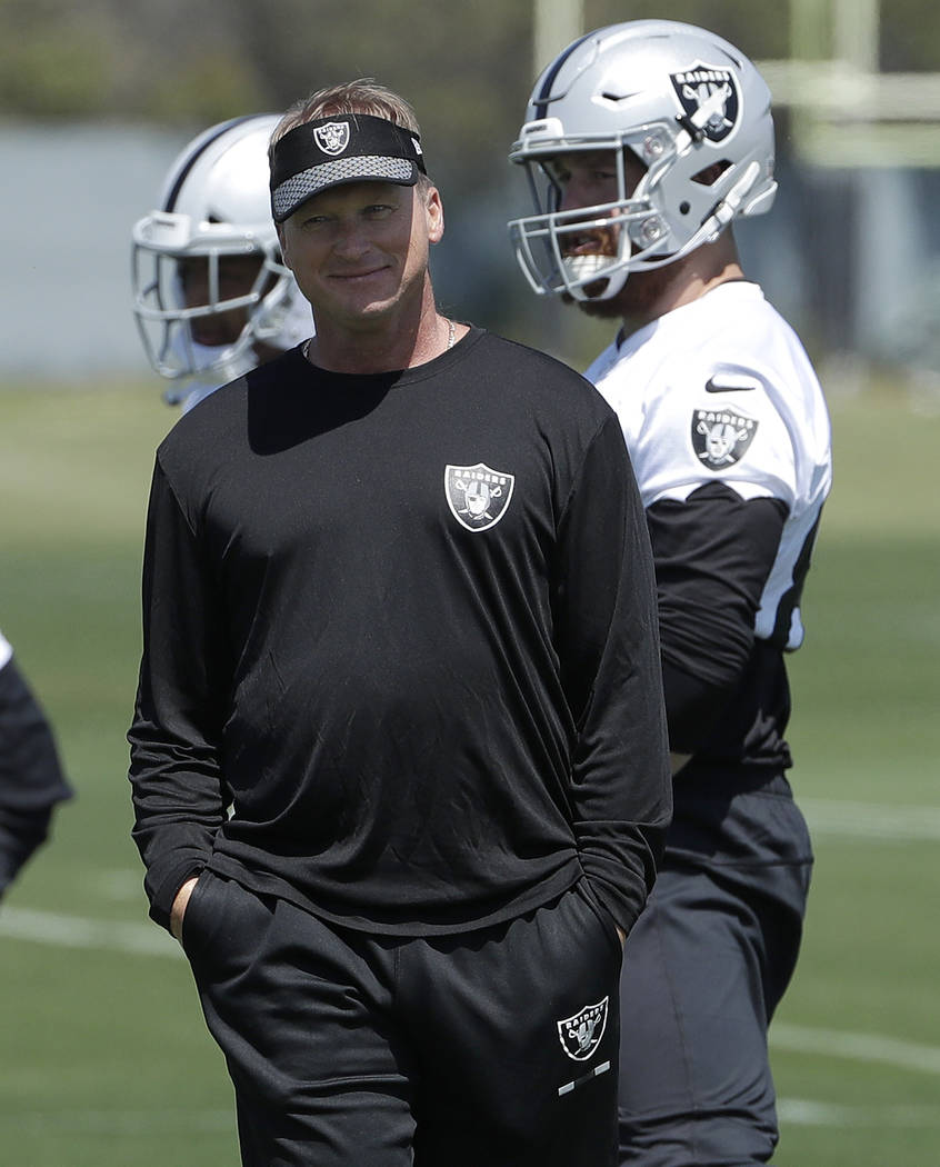 Oakland Raiders head coach Jon Gruden watches as players stretch at the team's football facility in Alameda, Calif., Tuesday, April 24, 2018. (AP Photo/Jeff Chiu)