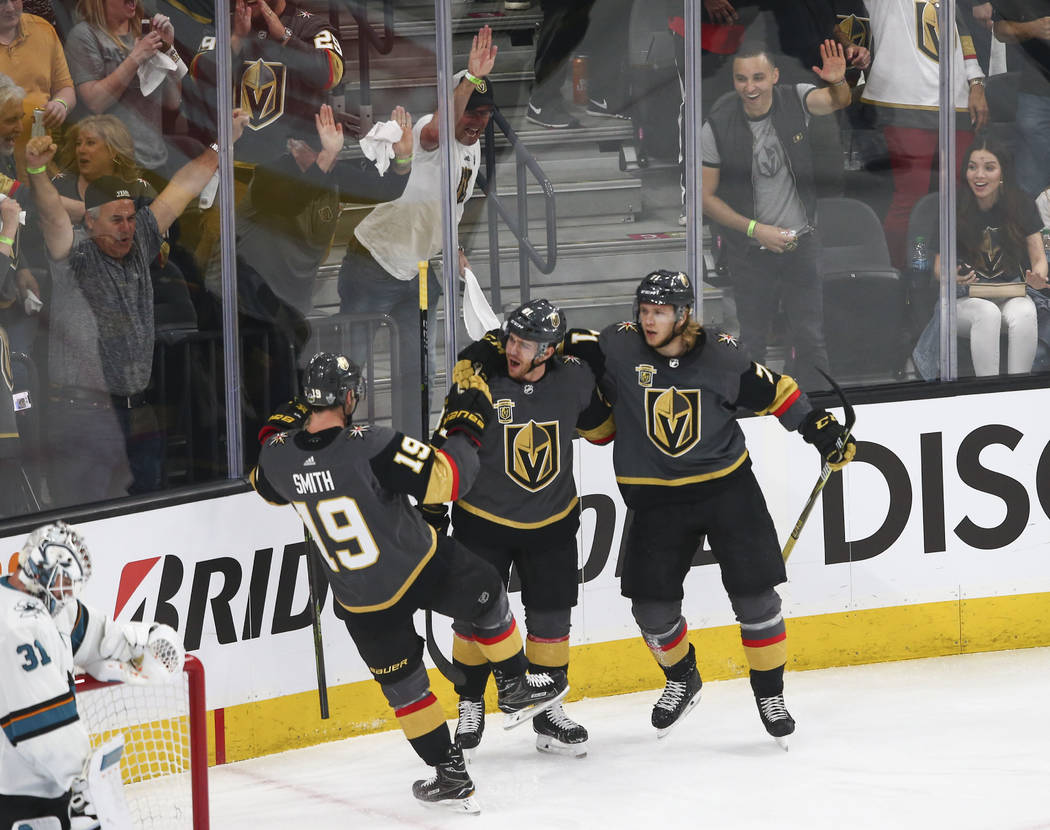 Golden Knights center Jonathan Marchessault, center, celebrates his goal against the San Jose Sharks with right wing Reilly Smith (19) and center William Karlsson (71) during the first period of G ...
