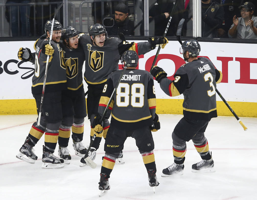 Golden Knights center Cody Eakin, second from left, celebrates his goal against the San Jose Sharks with teammates during the first period of Game 1 of an NHL hockey second-round playoff series at ...