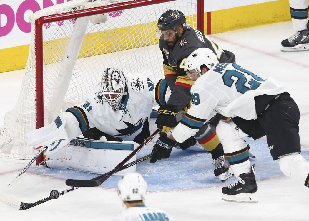 Golden Knights left wing Pierre-Edouard Bellemare (41) battles for the puck against San Jose Sharks goaltender Martin Jones (31) and right wing Timo Meier (28) during the first period of Game 1 of ...