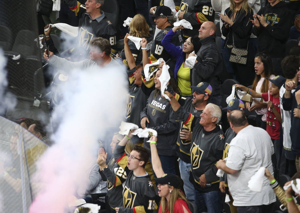 Golden Knights fans celebrate a goal by Golden Knights defenseman Shea Theodore, not pictured, during the second period of Game 1 of an NHL hockey second-round playoff series against the San Jose ...