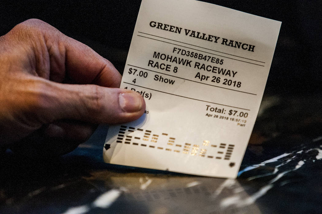 A sports better displays his ticket from a horse race at the Green Valley Ranch sports book in Henderson on Thursday, April 26, 2018. Patrick Connolly Las Vegas Review-Journal @PConnPie