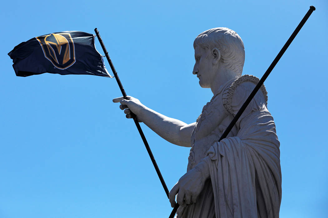 A view of a statue holding a Vegas Golden Knights flag at Caesars Palace in Las Vegas on Saturday, April 28, 2018. Andrea Cornejo Las Vegas Review-Journal @dreacornejo