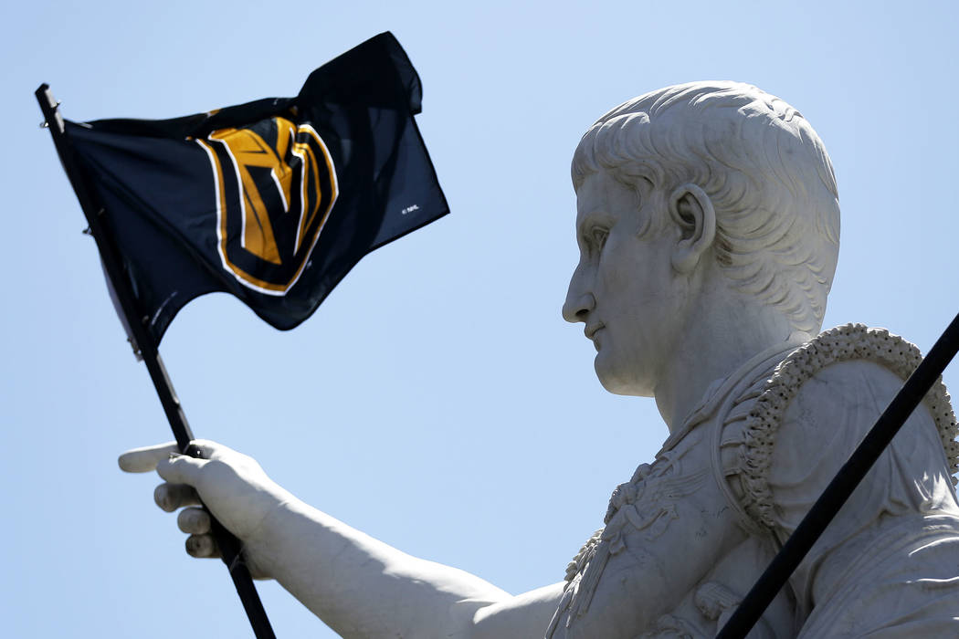 A view of a statue holding a Vegas Golden Knights flag at Caesars Palace in Las Vegas on Saturday, April 28, 2018. Andrea Cornejo Las Vegas Review-Journal @dreacornejo