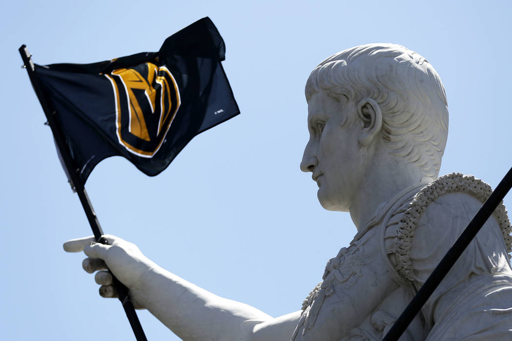 Caesars Palace statue gets decked out in Golden Knights gear