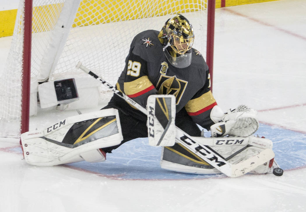 Golden Knights goaltender Marc-Andre Fleury (29) makes a save in overtime during game two of their second round playoff series on Saturday, April 28, 2018, at T-Mobile Arena, in Las Vegas. Benjami ...