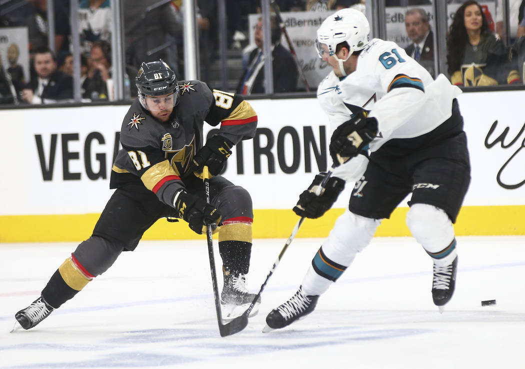 Golden Knights center Jonathan Marchessault (81) sends the puck past San Jose Sharks defenseman Justin Braun (61) during the first period of Game 2 of an NHL hockey second-round playoff series at ...