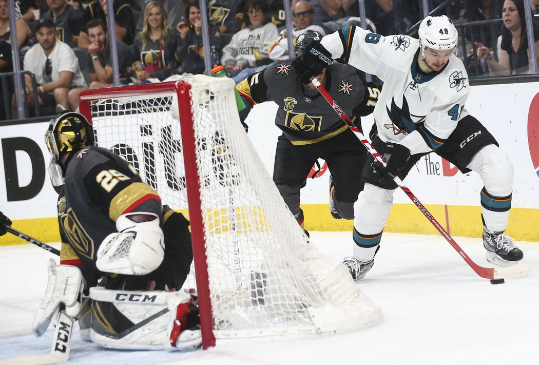 San Jose Sharks center Tomas Hertl (48) moves the puck past Golden Knights defenseman Jon Merrill (15) during the second period of Game 2 of an NHL hockey second-round playoff series at T-Mobile A ...