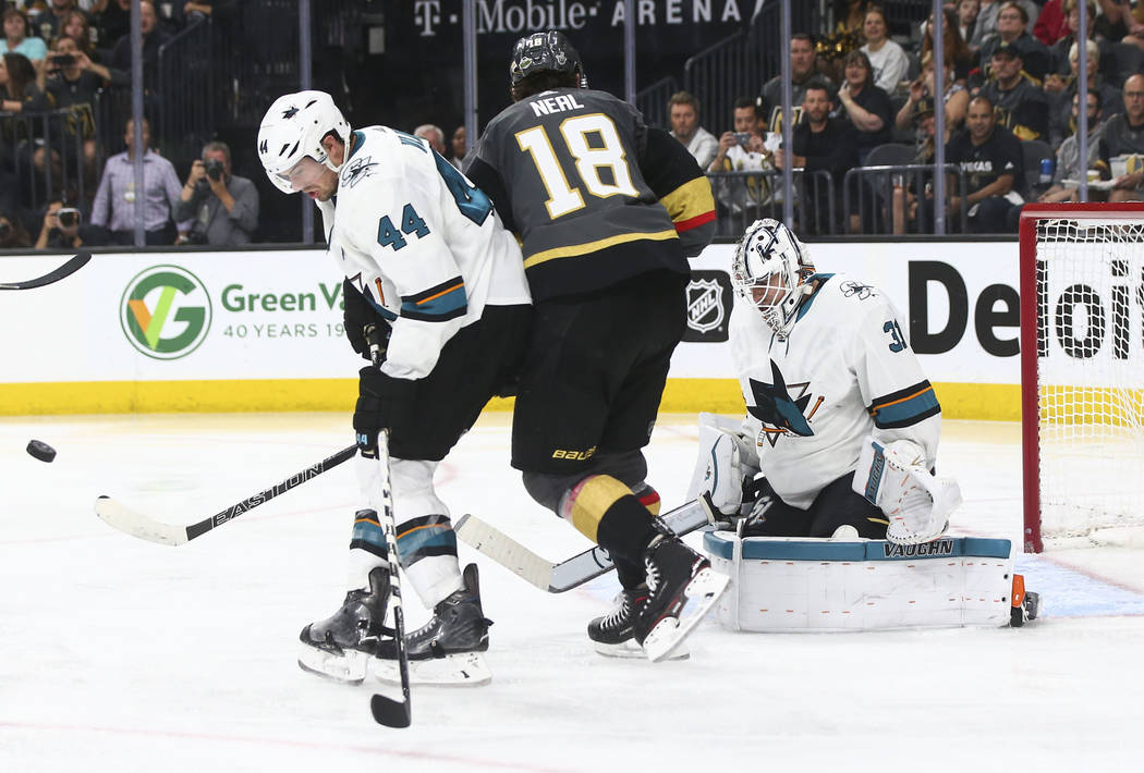 San Jose Sharks defenseman Marc-Edouard Vlasic (44) and goaltender Martin Jones (31) defend between Golden Knights left wing James Neal (18) during the second overtime period of Game 2 of an NHL h ...