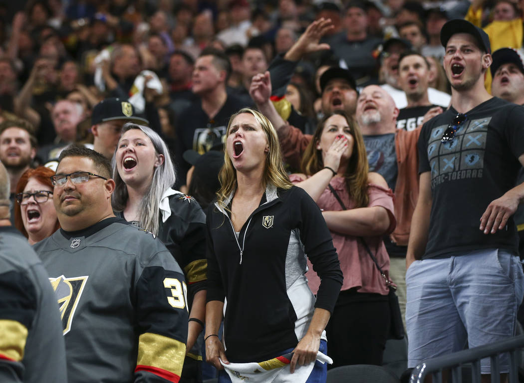 Golden Knights fans react to a bad call during the first overtime period of Game 2 of an NHL hockey second-round playoff series against the San Jose Sharks at T-Mobile Arena in Las Vegas on Saturd ...