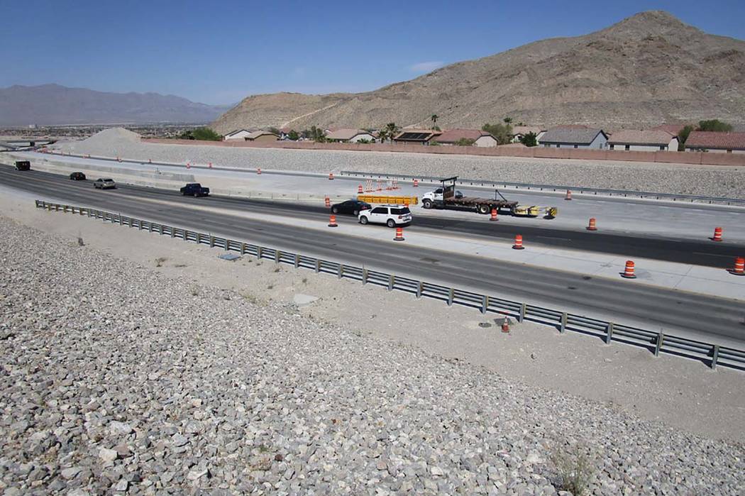 Traffic follows lane closures around barriers on the 215 Beltway just south of Lone Mountain Road on Saturday, April 28, 2018. Travel lanes will be opened to northbound traffic this week. (Greg Ha ...