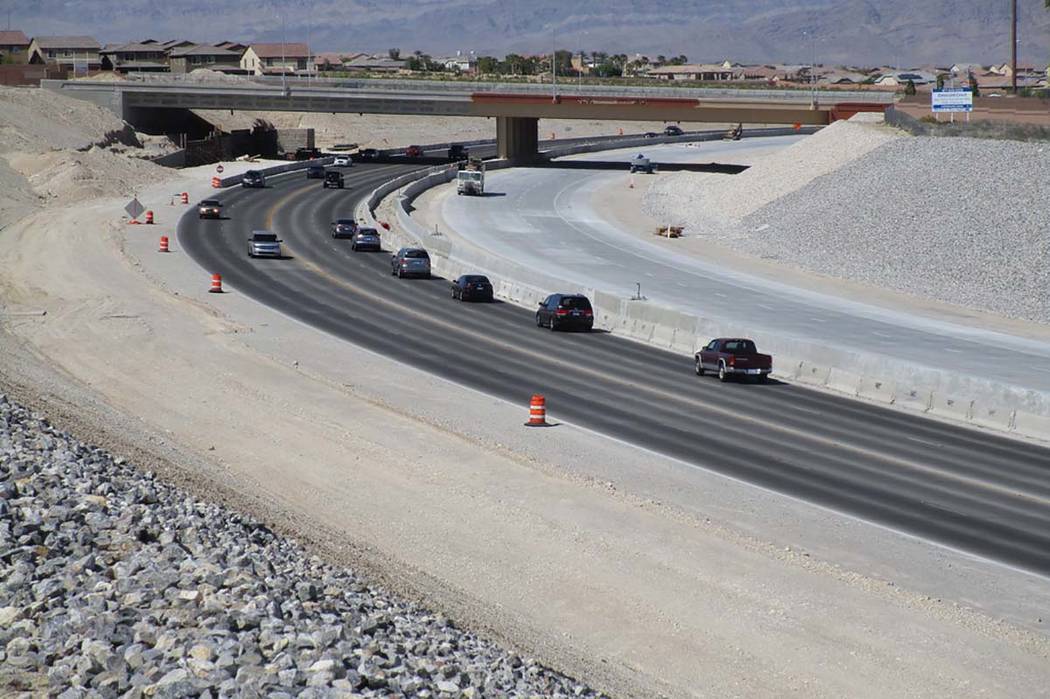 Traffic shares the lanes that will be dedicated to southbound traffic near the Centennial Parkway overpass on the 215 Beltway on Saturday, April 28, 2018. Travel lanes will be opened to northbound ...