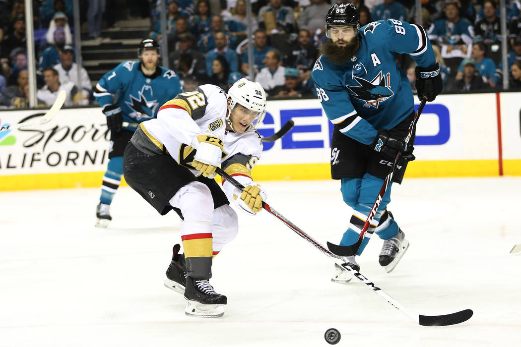 Vegas Golden Knights left wing Tomas Nosek (92) goes for the puck against San Jose Sharks defenseman Brent Burns (88) during the first period in Game 3 of an NHL hockey second-round playoff series ...