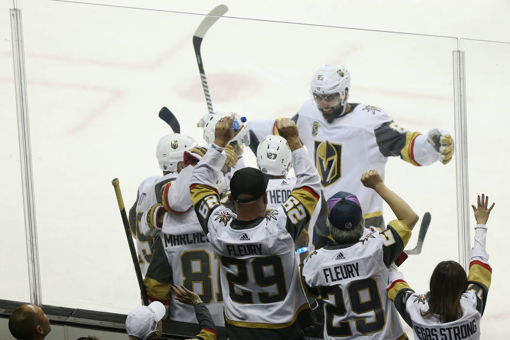 Fans watch the Vegas Golden Knights celebrate a score by center Jonathan Marchessault (81) during the second period in Game 3 of an NHL hockey second-round playoff series at the SAP Center in San ...