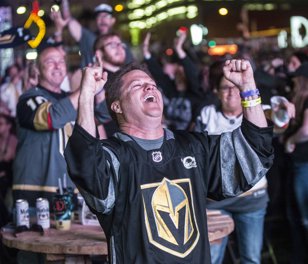 Golden Knights fan Rob Lawrence celebrates after a second period goal at a watch party during game three of Vegas' playoff series with the San Jose Sharks on Monday, April 30, 2018, at Downtown La ...