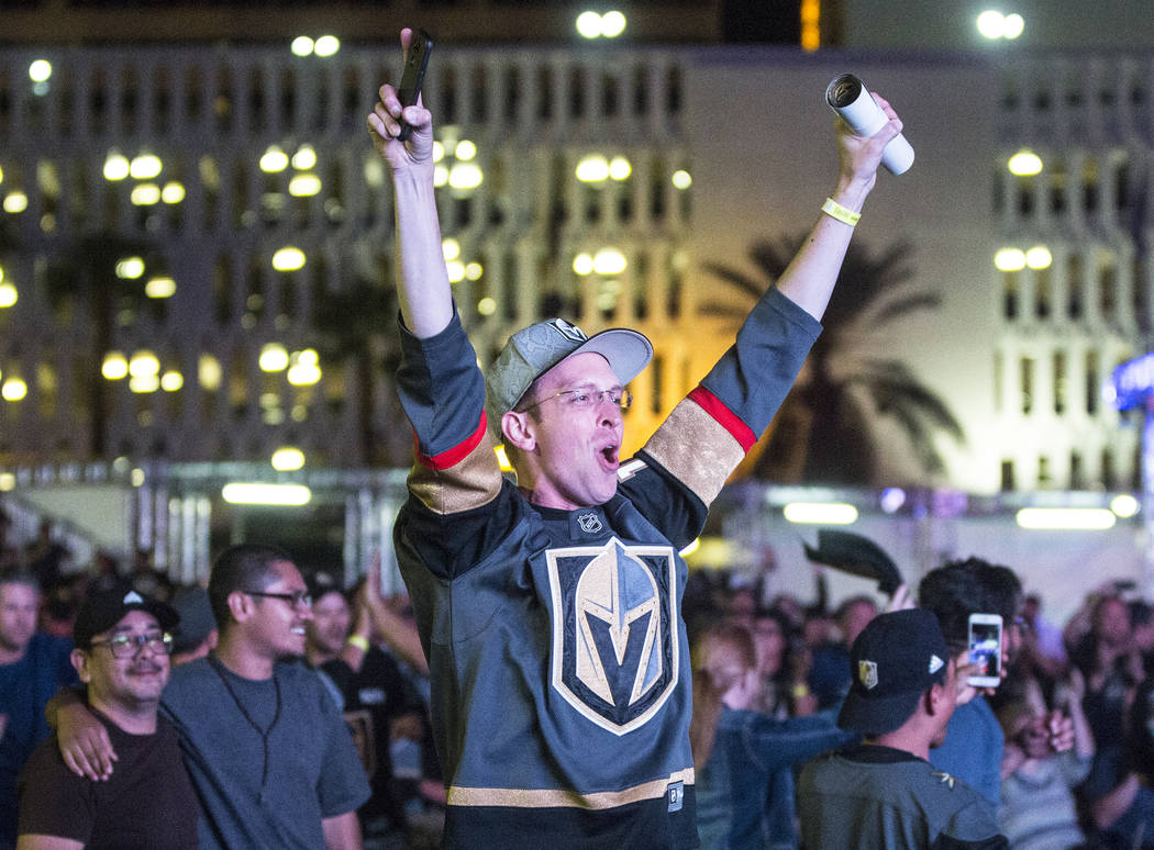 Golden Knights fan Anthony Soleau cheers after a second period goal at a watch party during game three of Vegas' playoff series with the San Jose Sharks on Monday, April 30, 2018, at Downtown Las ...