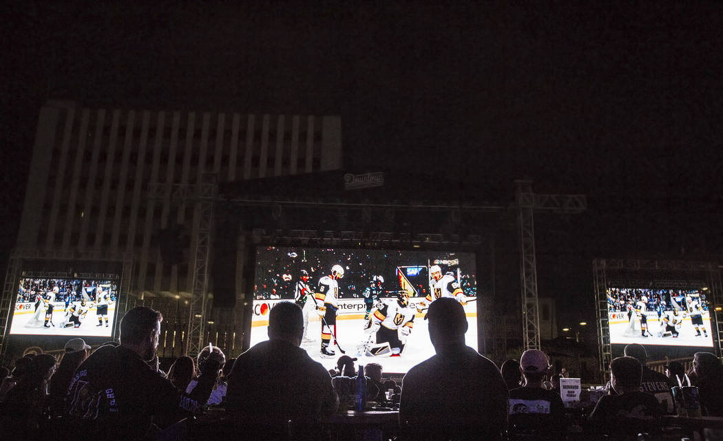 Golden Knights fans fill the Downtown Las Vegas Events Center for a watch party during game three of Vegas' playoff series with the San Jose Sharks on Monday, April 30, 2018, in Las Vegas. Benjami ...