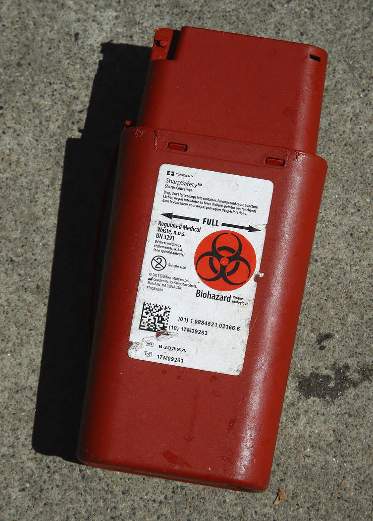 In this photo taken on Thursday, April 26, 2018, a biohazard container used for the storage of used needles sits on a sidewalk in San Francisco. San Francisco may have hit peak saturation with ten ...