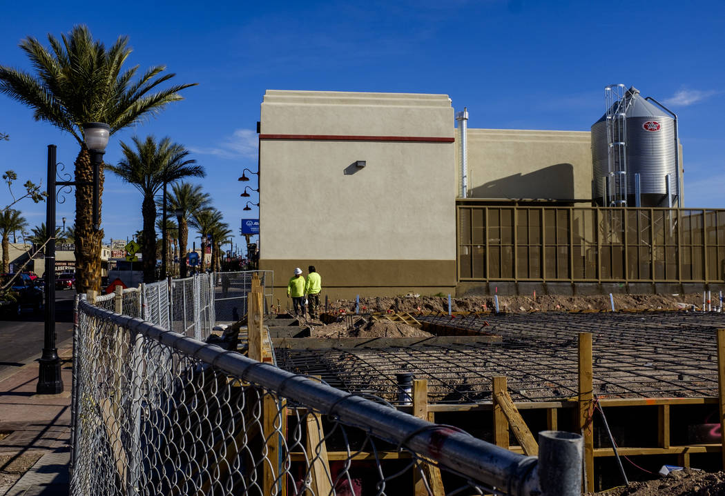 Construction workers at construction site for Juan's Flaming Fajitas and Cantina with Lovelady Brewing Co. in the background on Water Street in Henderson on Friday, March 30, 2018.  Patrick Connol ...