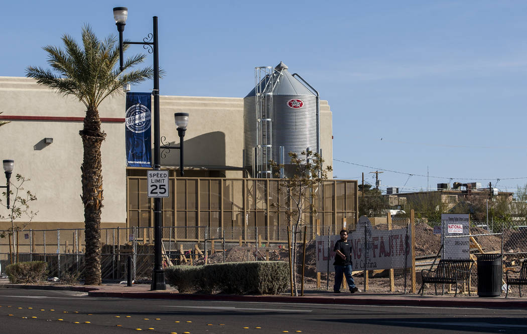 A man walks past the construction site for Juan's Flaming Fajitas and Cantina and Lovelady Brewing Co. on Water Street in Henderson on Friday, March 30, 2018.  Patrick Connolly Las Vegas Review-Jo ...