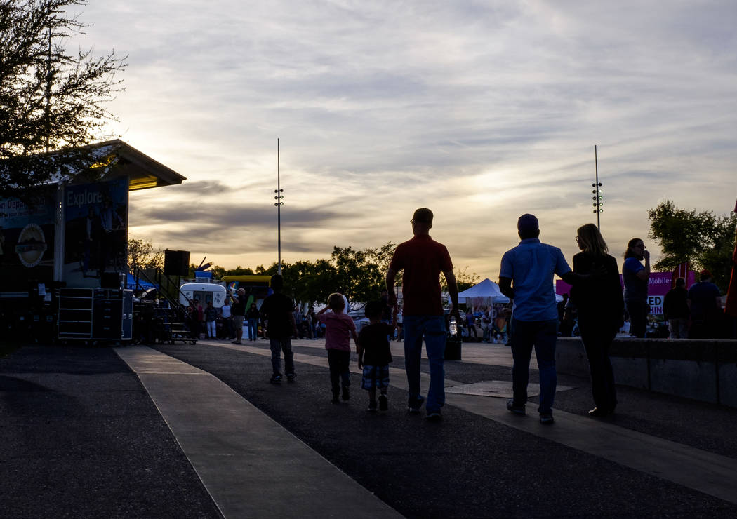 People walk onto the event plaza on Water Street in Henderson for a Last Friday event on Friday, March 30, 2018.  Patrick Connolly Las Vegas Review-Journal @PConnPie