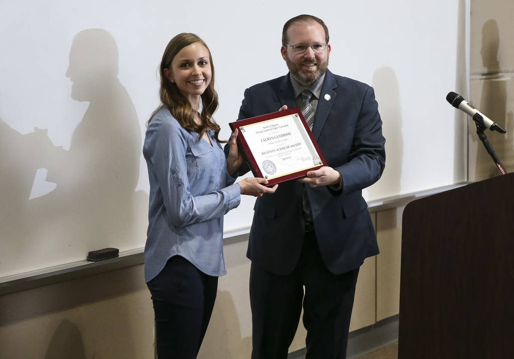 College of Southern Nevada student Lauryn Guerrissi, left, receives the Regents Scholar Award from the Board of Regents' Dr. Patrick Carter during CSN's Outstanding Student Award Ceremony at CSN's ...