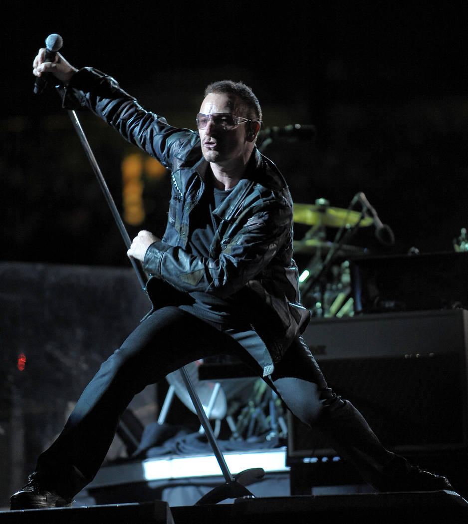 Lead singer Bono of the rock band U2 performs with the band during their 360Â° world tour stop at Giants Stadium in East Rutherford, NJ on Thursday, Sept. 24, 2009. (AP Photo/Evan Agosti ...