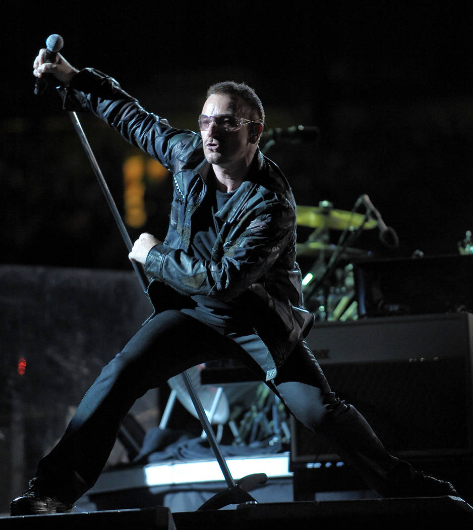 Lead singer Bono of the rock band U2 performs with the band during their 360° world tour stop at Giants Stadium in East Rutherford, NJ on Thursday, Sept. 24, 2009. (AP Photo/Evan Agosti ...